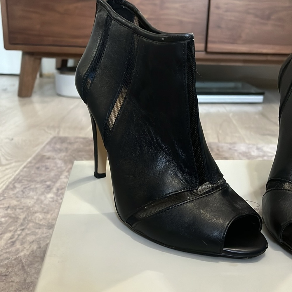 Sexy open toe boots in excellent condition. Only worn once.
